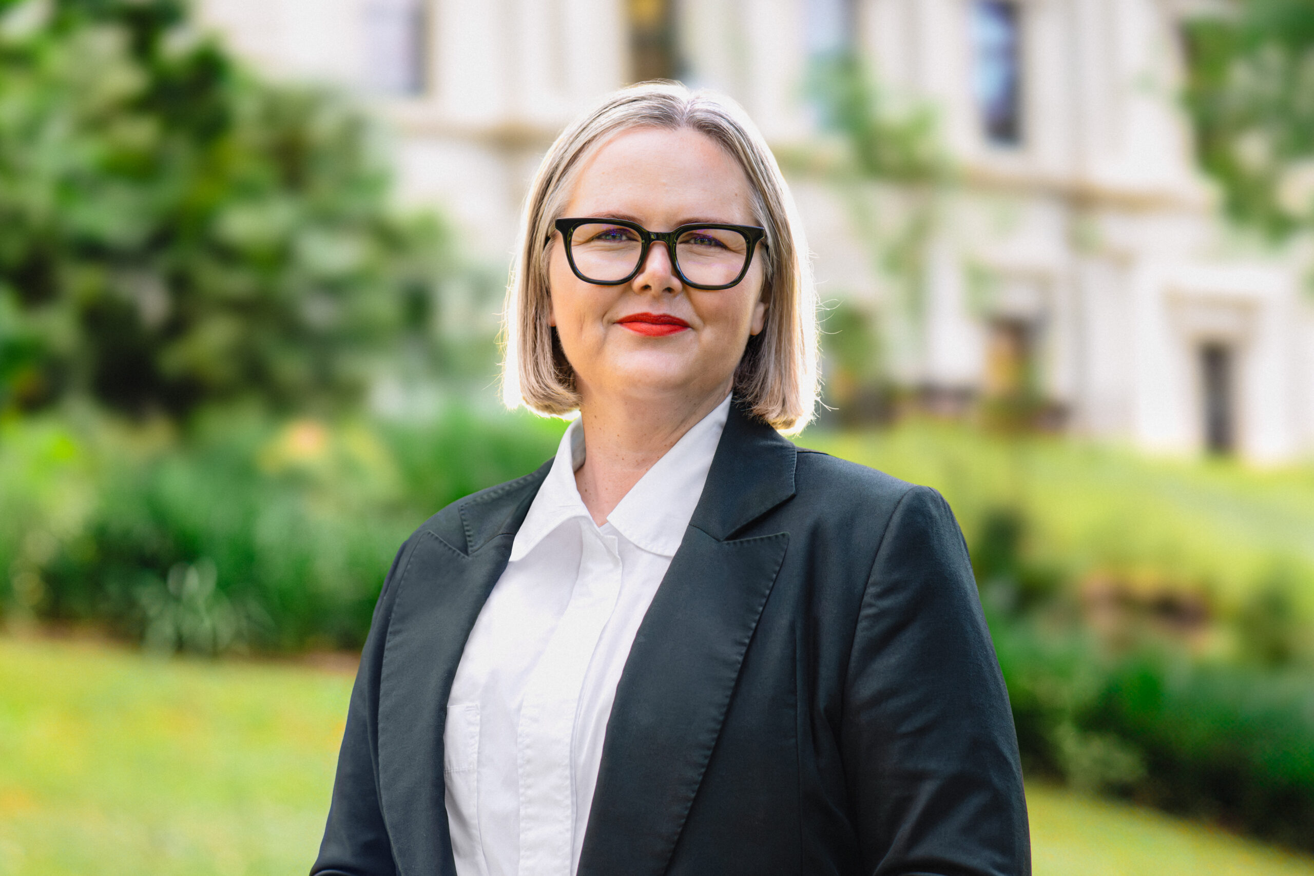 Professional headshot of Brigid Monagle, Commissioner.